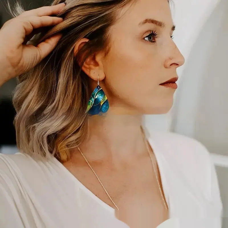 A pair of flat branch knot design drop earrings made from printed acrylic, shown in a selected style.