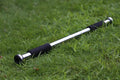Adjustable steel pull-up bar mounted in door frame for home fitness