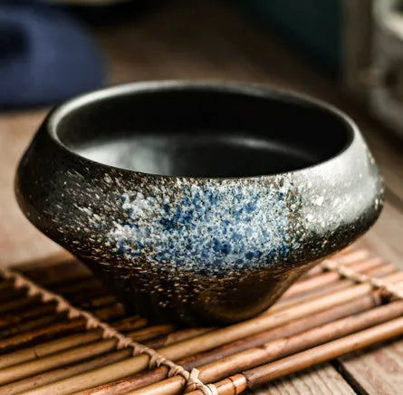 Tall porcelain Japanese soup bowl with stone conch shape and underglaze retro pattern.