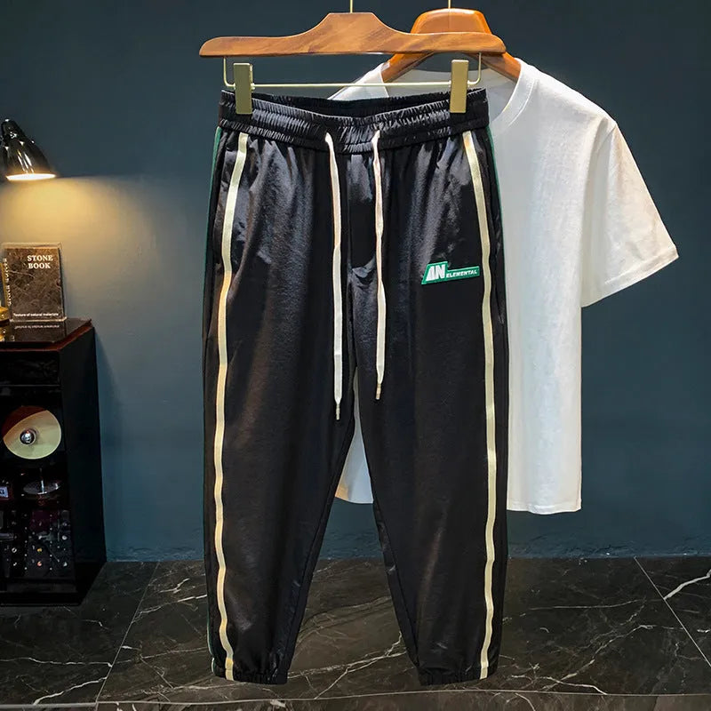 Men's black and grey cotton harem-style casual trousers with mid waist design