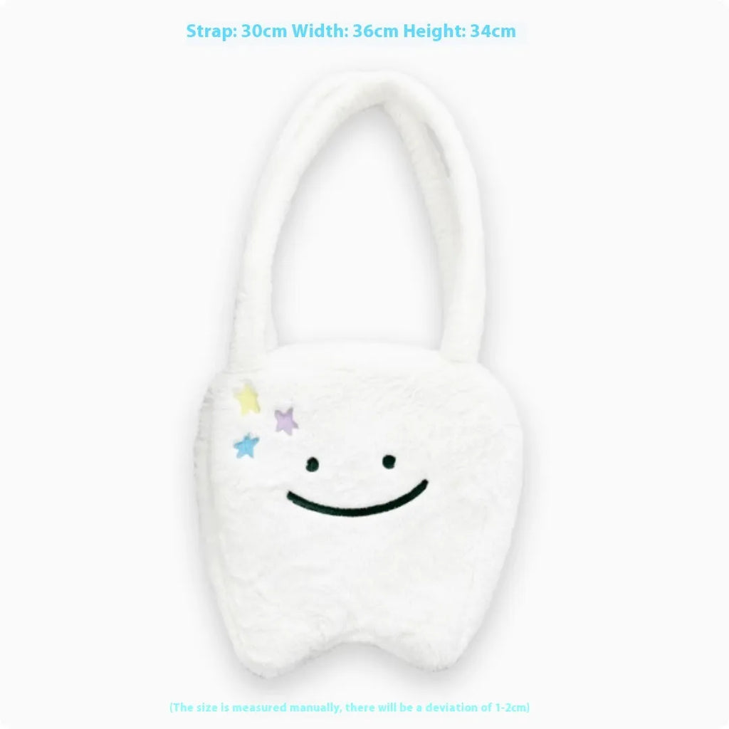 White plush large tooth shoulder tote bag with zip opening shown as crossbody carry