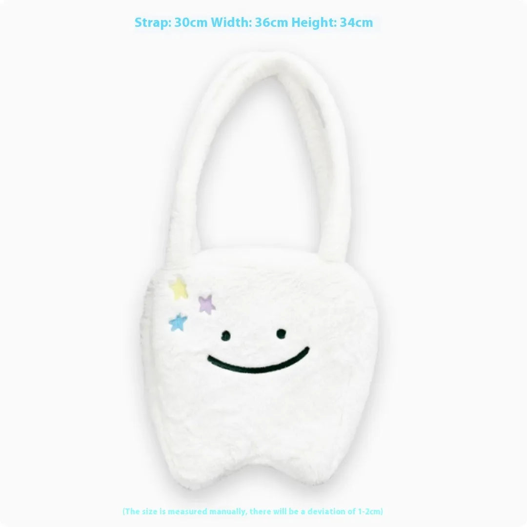 White plush large tooth shoulder tote bag with zip opening shown as crossbody carry