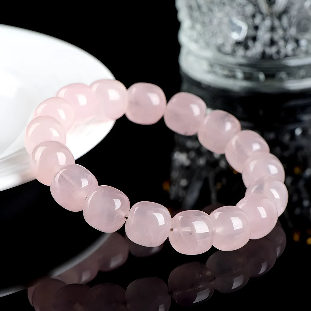 Pink crystal barrel bead bracelet with bamboo accents and geometric design