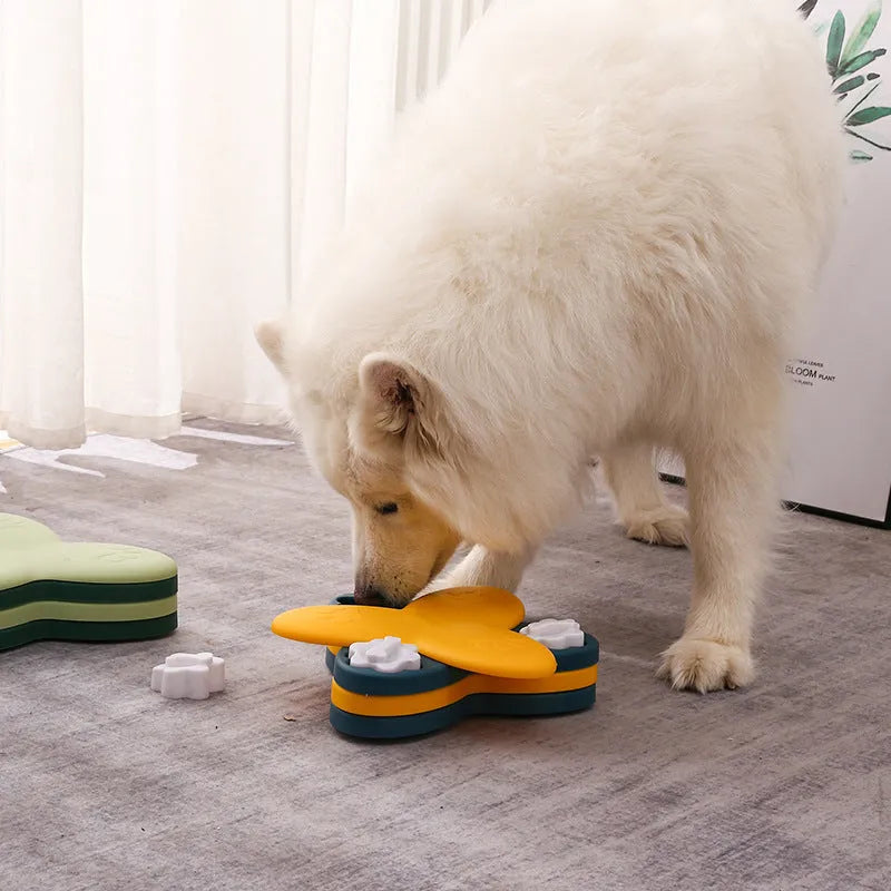 Green and yellow dog puzzle toy with bone-shaped covers and non-slip base.