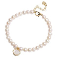 Women's freshwater pearl bracelet with fan-shaped alloy charm on a 16cm elastic string.