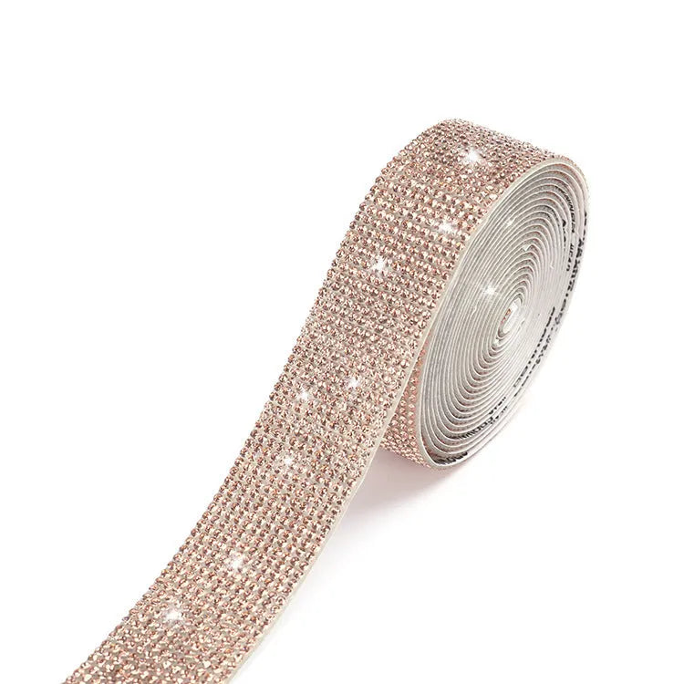 A long strip of electroplated glass self-adhesive water drill for clothing decoration in white and AB colour.