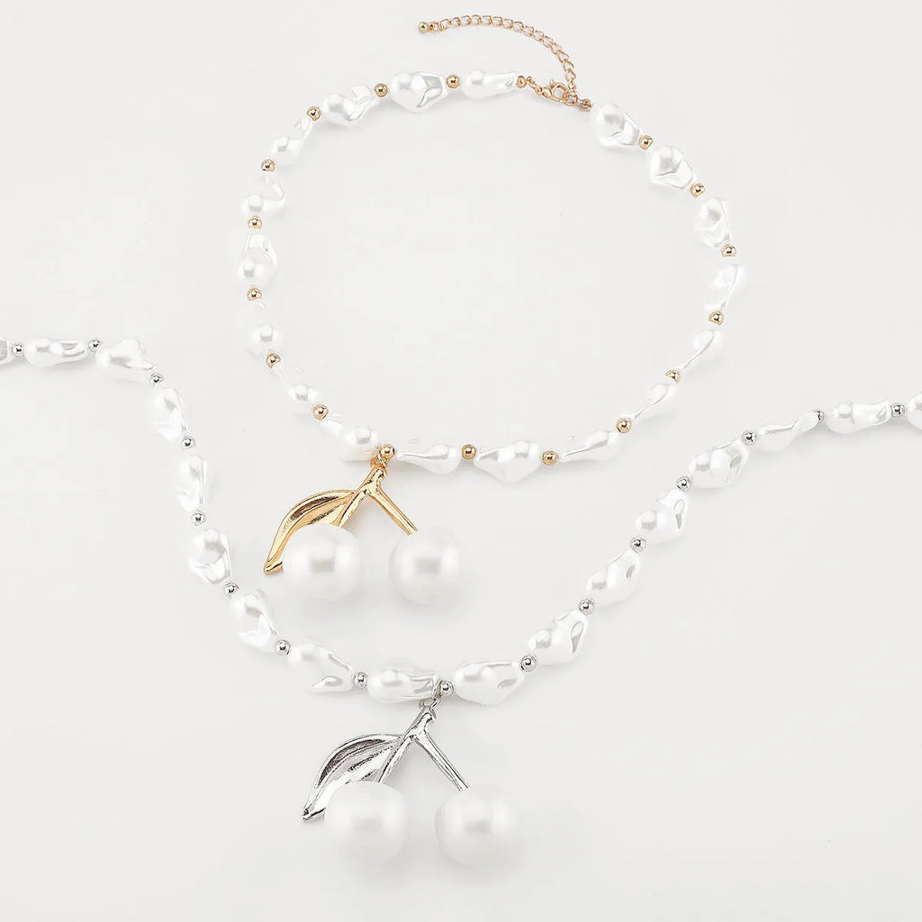 Creative women's necklace with geometric cherry fruit pendant on imitation pearl chain, adjustable 51-60cm length