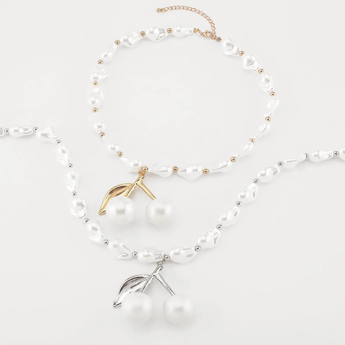Creative women's necklace with geometric cherry fruit pendant on imitation pearl chain, adjustable 51-60cm length