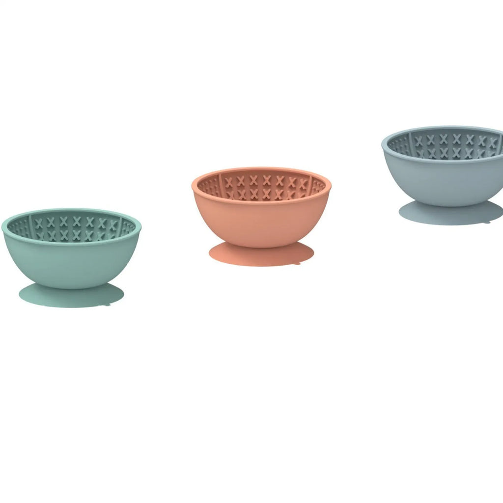 Cyan silicone dog lick mat bowl with textured surface and suction cup base