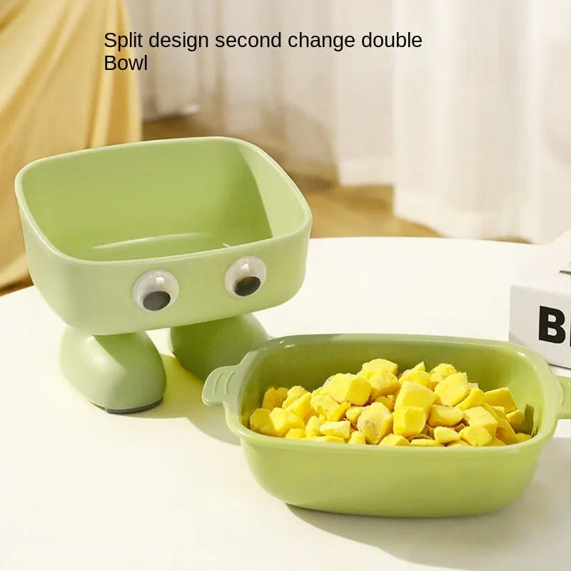 Green elevated cat bowl with cartoon robot design and 15° tilt angle