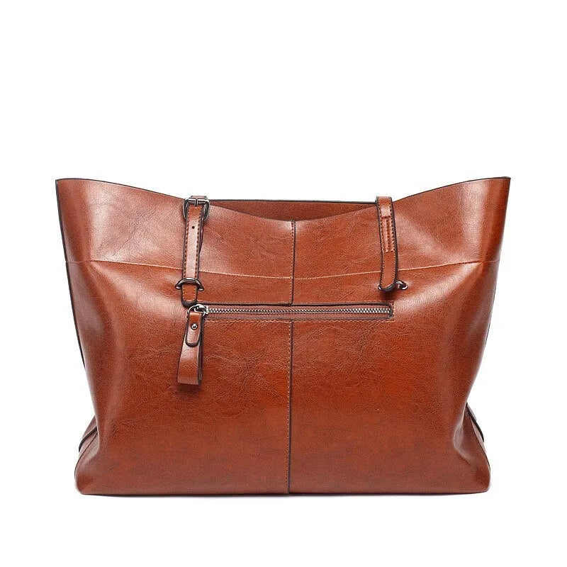 Genuine cowhide leather cross-body handbag showing two compartments and available in five colours