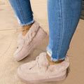 Cotton loafer shoes with a velvet lining, round toe, and textured rubber sole in a light pink colour.