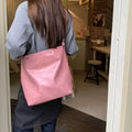 Corduroy one-shoulder commuter bag showing interior organisation and dimensions