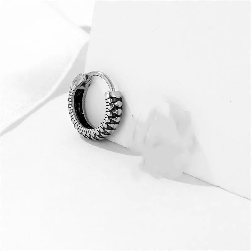 Silver geometric earrings with a retro twist striped pattern, made from titanium steel.
