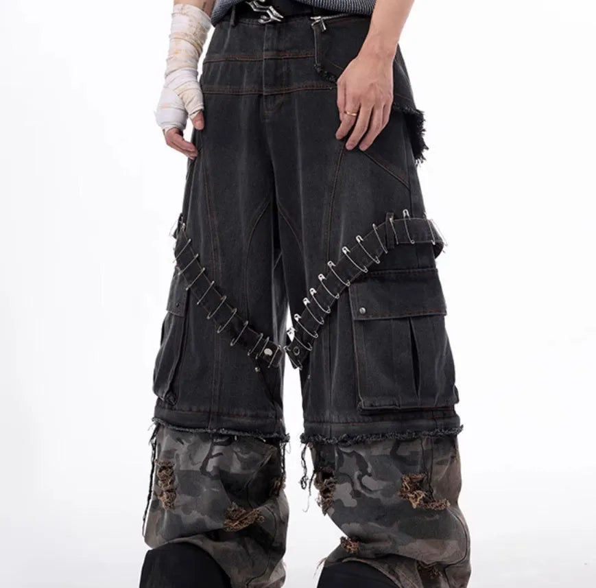 Men's grey camouflage jeans with splicing panels and ribbon detail on cotton denim.