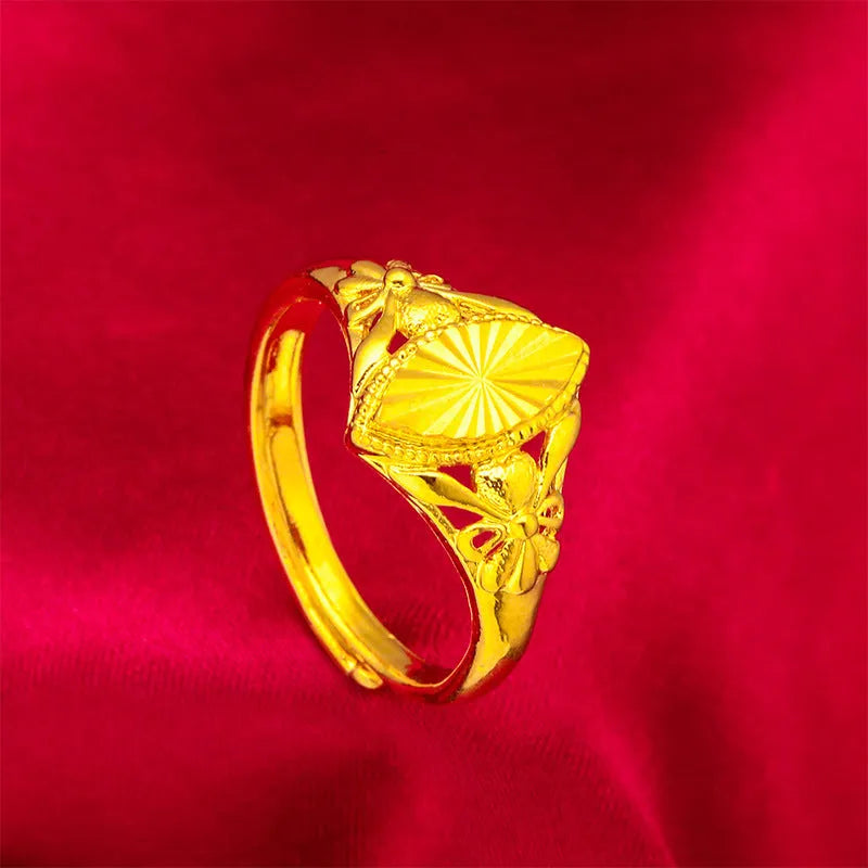 Gold-coloured geometric brass ring with textured design elements for women