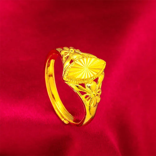 Gold-coloured geometric brass ring with textured design elements for women