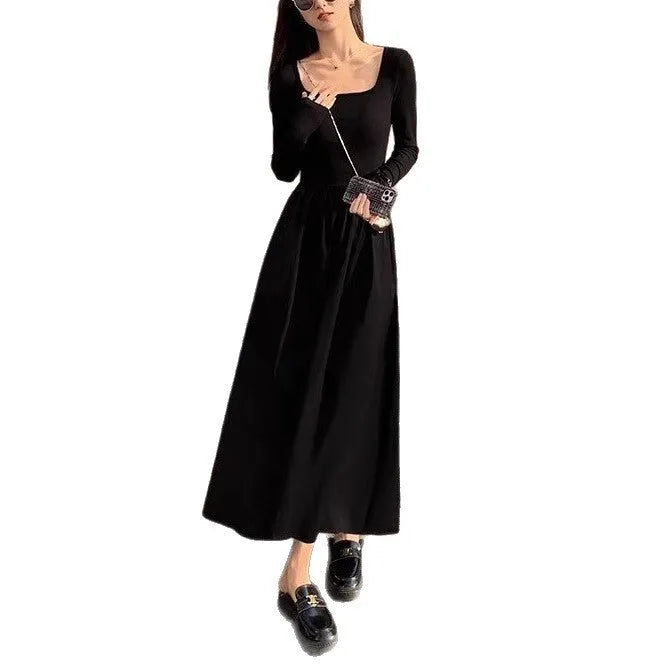 Women's black square collar knitted dress with long sleeves and an A-line skirt.