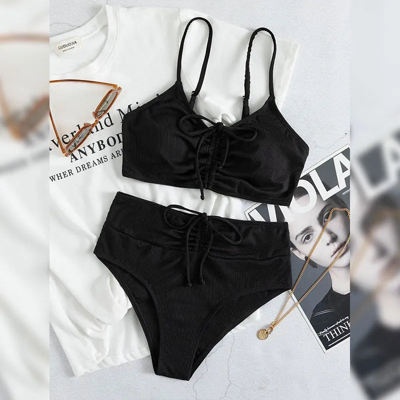 Black women's high-waisted bikini with sling split shorts and sleeveless top
