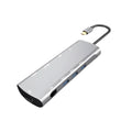 Grey aluminium USB-C docking station with HDMI, VGA, USB ports, and a short connecting cable