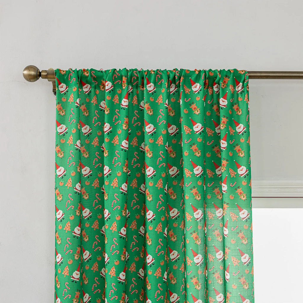 Christmas snowman angel print curtain in green colour with cartoon figures pattern