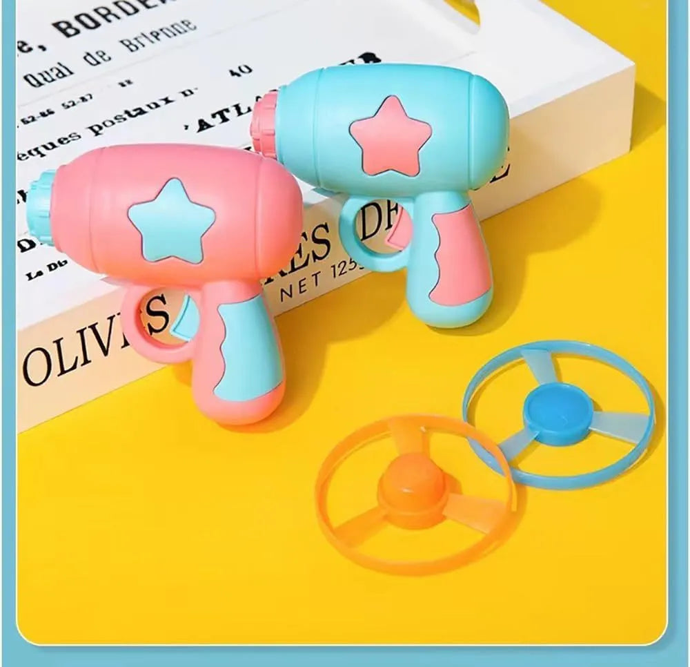 Blue or pink plastic cat toy gun with frisbee, showing compact size for indoor cat play.