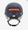 Cycling helmet with integrated LED brake light and running lights in black PC shell