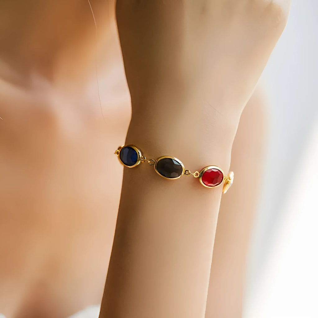 Geometric ellipse women's bracelet with blue glass inlay on an 18K copper band.