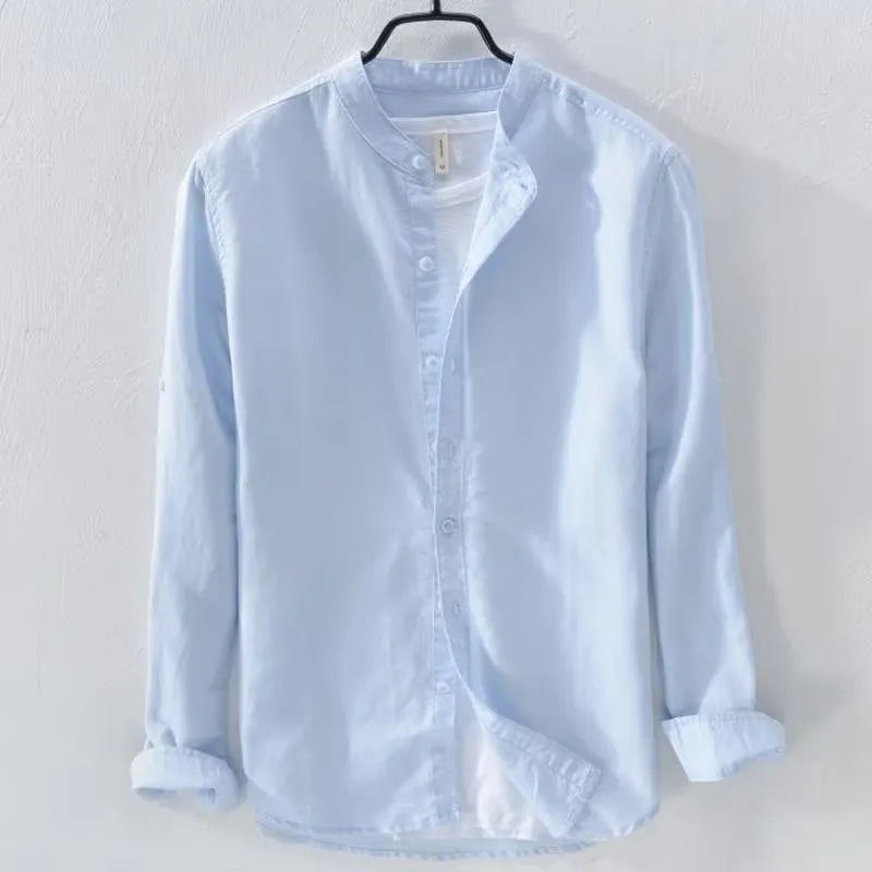 Man wearing a loose fit light blue long sleeve linen casual shirt