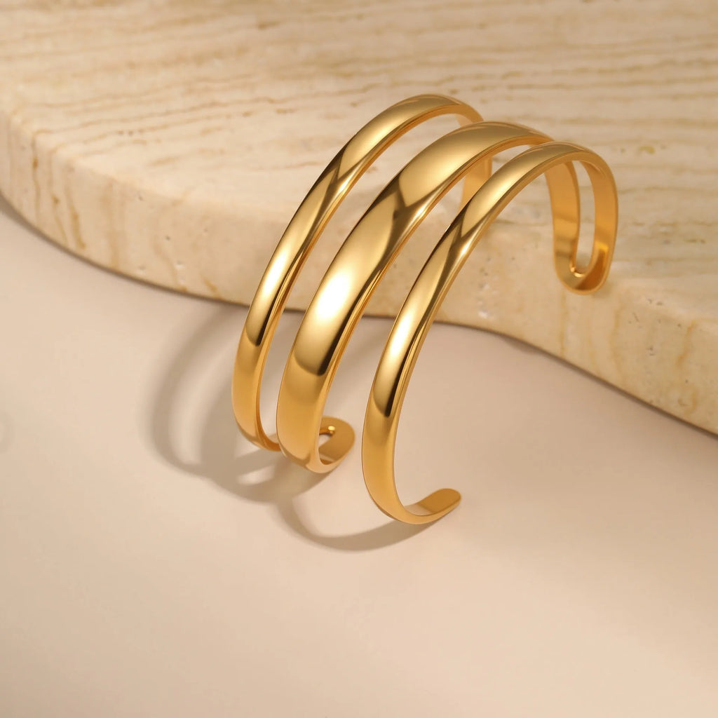 Gold electroplated stainless steel geometric line bracelet for women with a simple clasp.