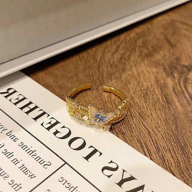 Butterfly women's copper ring with adjustable split ring design showing oil-drip colour treatment