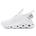 Children's Velcro sneakers in black, khaki, or white with fabric upper and textured sole.
