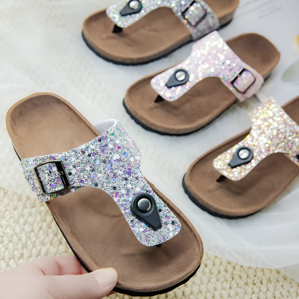Children's cork flip-flops in gold with a hollow-out design and PVC sole.