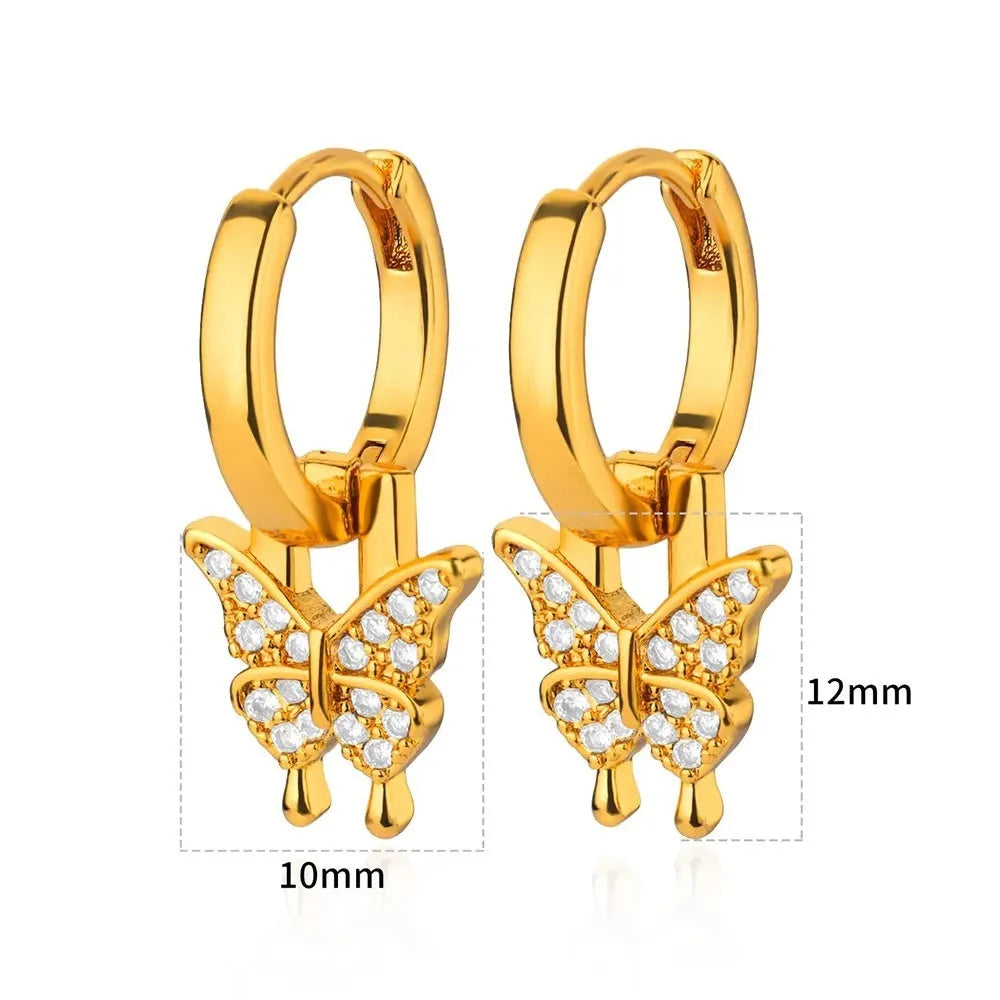Women's geometric butterfly-shaped copper earrings with heart and star details in assorted colours.