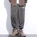 Men's grey casual sweatpants with an ankle tie and straight-leg fit.