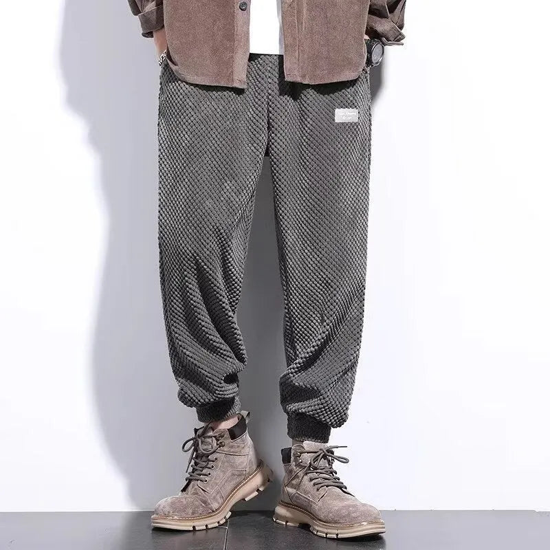 Men's grey casual sweatpants with an ankle tie and straight-leg fit.