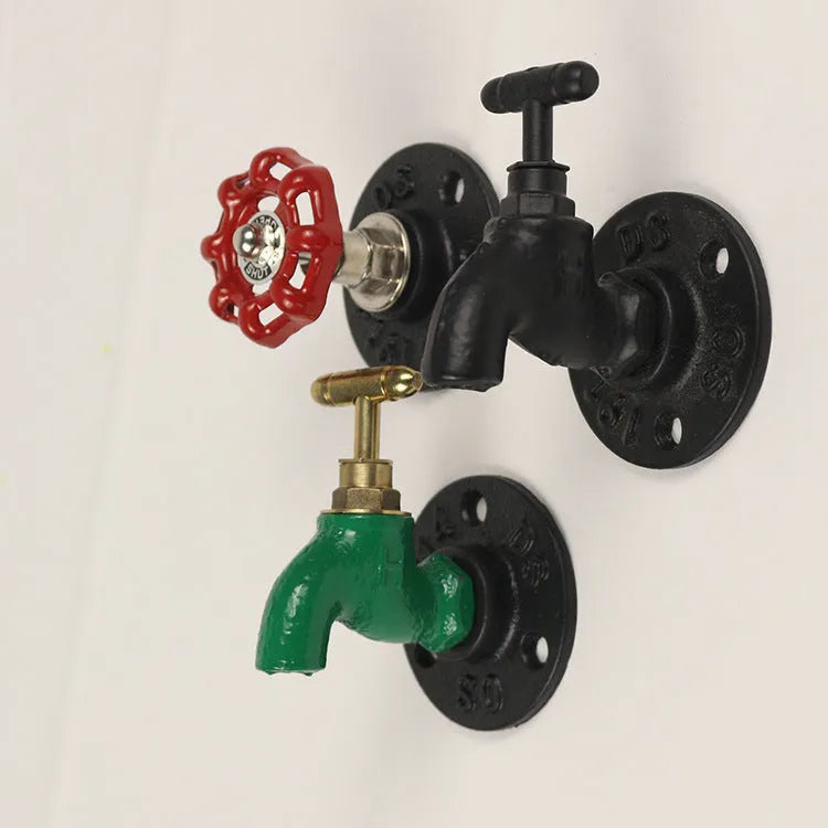 Water pipe style metal towel rack hook in black, green, or red on a white wall