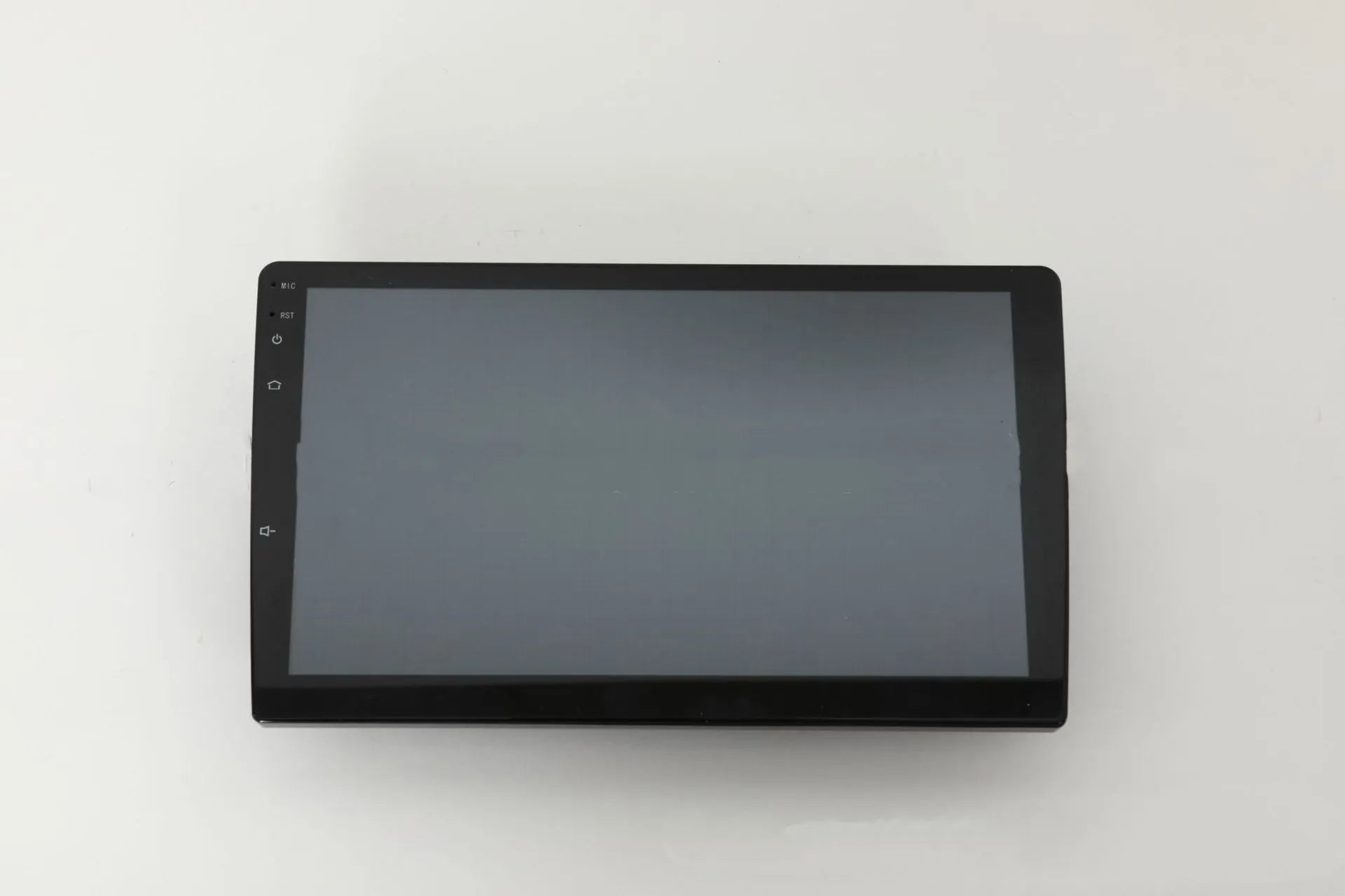 10.1 inch Android universal car stereo with black trapezoidal touch screen panel