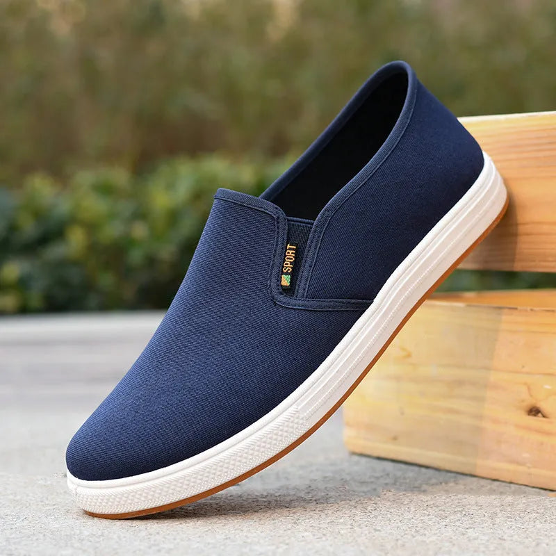 Men's black canvas slip-on shoes with round toe and shallow mouth design