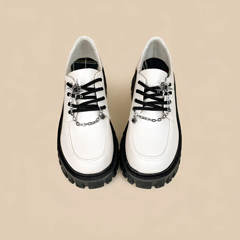 Women's preppy style loafers in Duke Asterism colour with metal cross shoulder strap and round toe