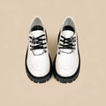 Women's preppy style loafers in Duke Asterism colour with metal cross shoulder strap and round toe