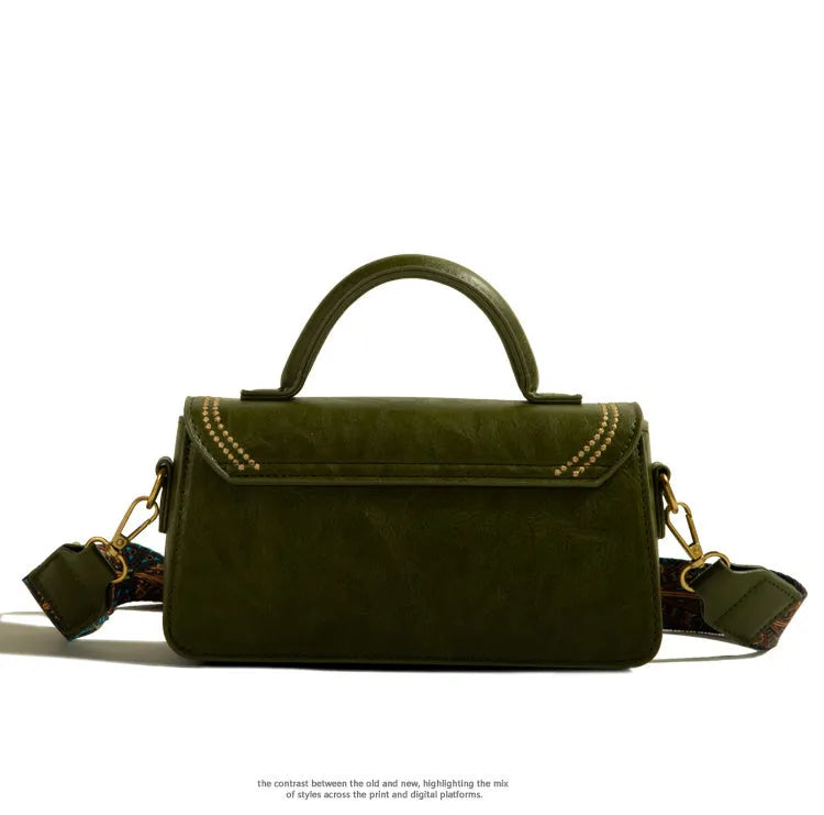 Brown retro messenger bag with square vertical shape showing sandwich pocket design and shoulder strap