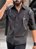 Black men's utility style button-up shirt with regular fit and polyester fabric