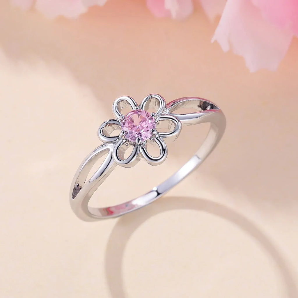 Women's floral hollowed fashion ring in electroplated finish showing flower design detail