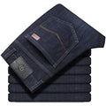 Black and blue loose fit stretch jeans straight-leg trousers on a hanger