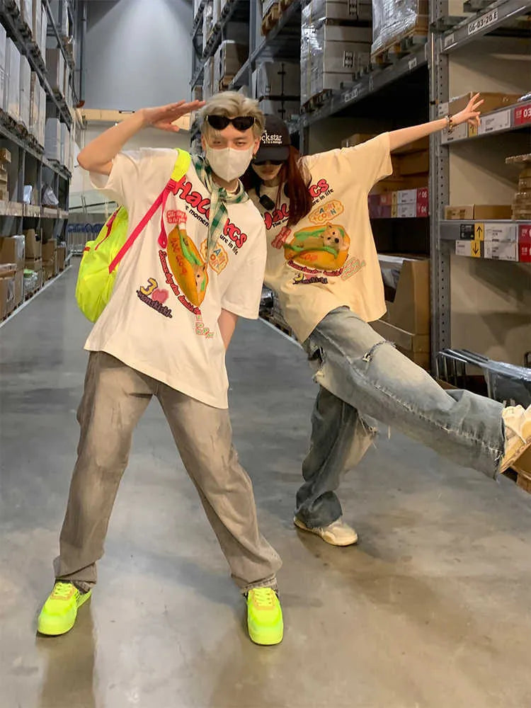 A white loose-fit cotton T-shirt with a large cartoon print of a hamburger dog.