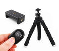 Black flexible octopus tripod with wrapped legs holding smartphone for angled photography