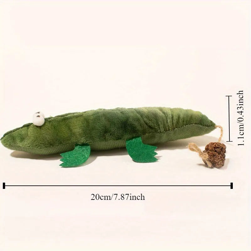 Green plush alligator catnip toy with natural peppermint scent for feline oral cleansing