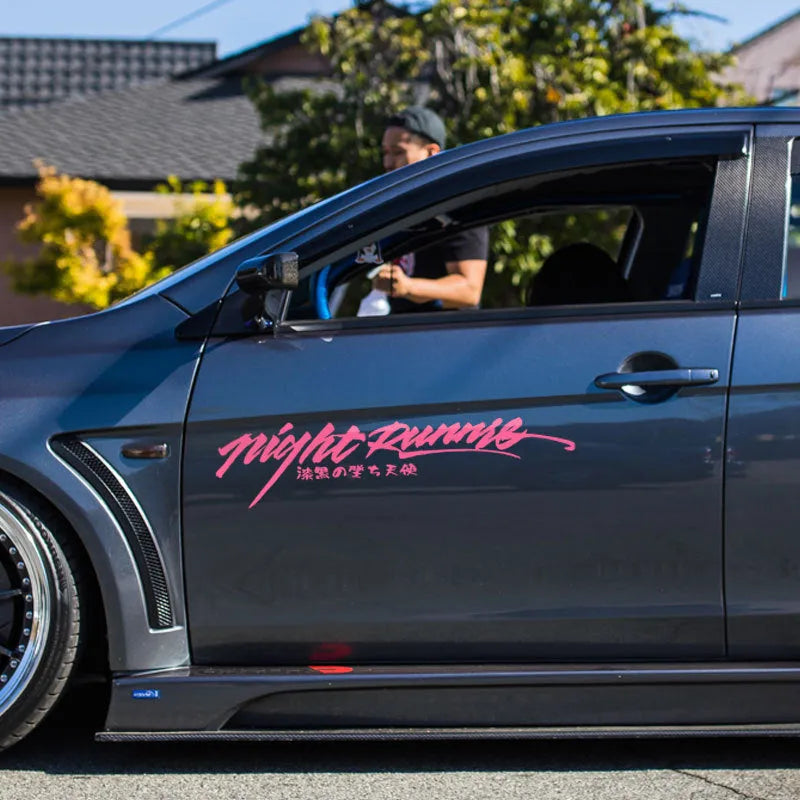 Nightwalker reflective adhesive car sticker for rear windshield in black, colourful, or pink.