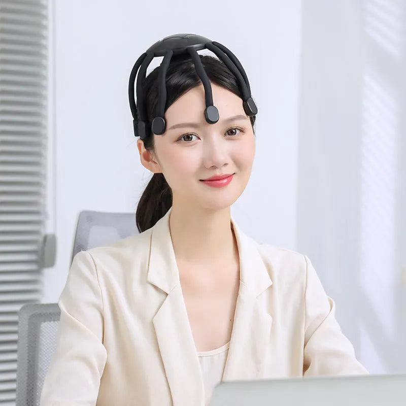 USB head massager with silicone claws showing black and white colour options
